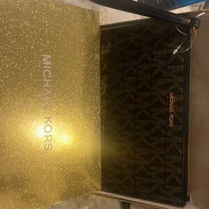 Michael Kors Large wristlet. Black with golden logos.